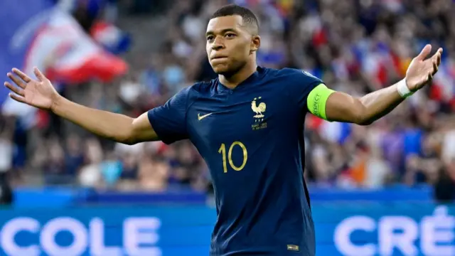 Kylian Mbappe celebrates scoring against Greece