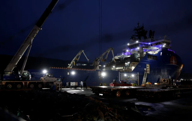 At a port in St John's, US Air Force equipment is loaded onto the Horizon Arctic, one of the vessels deployed to the search area