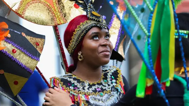 A person wears a costume to mark the 75th anniversary