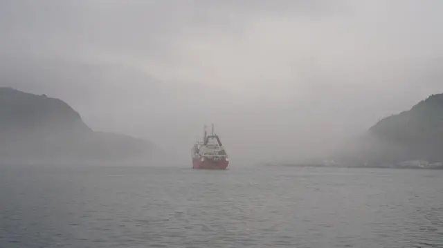 Fog rolls into the harbour of St Johns