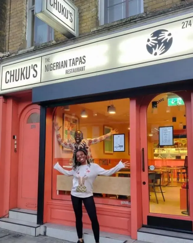 Woman outside Chuku's restaurant