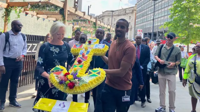 A floral Windrush anchor at the head of the Walk of Witness