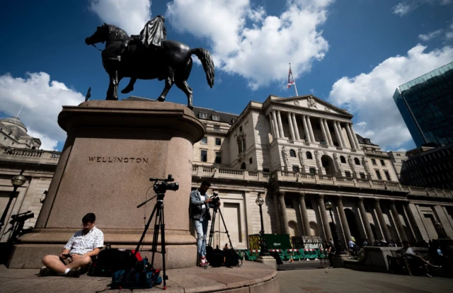 Media gather outside Bank of England in central London