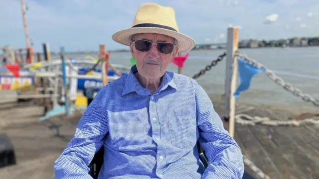 Peter Dielhenn pictured next to the Tilbury dock