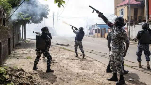 Officers fire rubber bullets and teargas at supporters of the opposition party, All People's Congress (APC) in Freetown, Sierra Leone - 21 June 2023