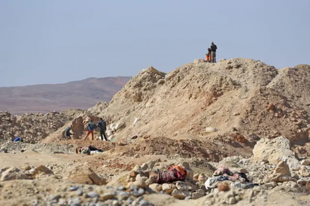 Illegal miners look for diamonds at the old abandoned De Beers Mines on November 03, 2022 in Komagass, South Africa