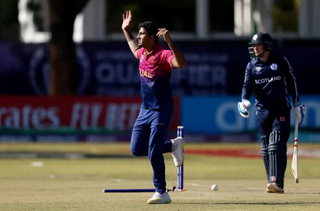 Junaid Siddique celebrates after taking the wicket of Matthew Cross