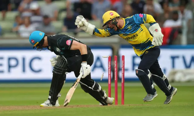 Alex Davies of Birmingham Bears celebrates after stumping out Adam Hose