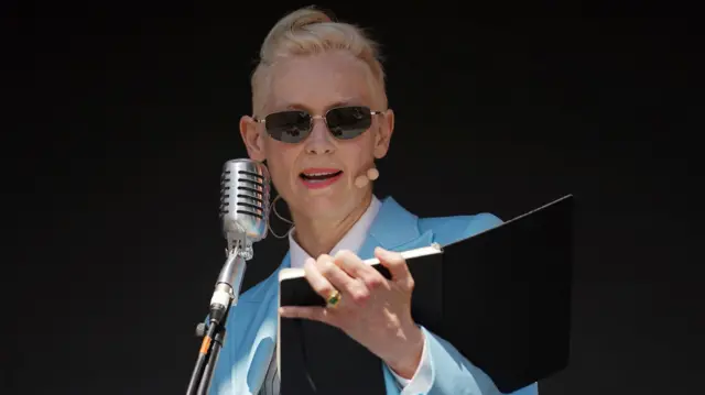 Tilda Swinton reading from a book