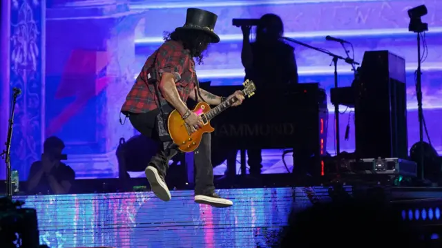 Slash from Guns N' Roses performing on the Pyramid Stage at the Glastonbury Festival