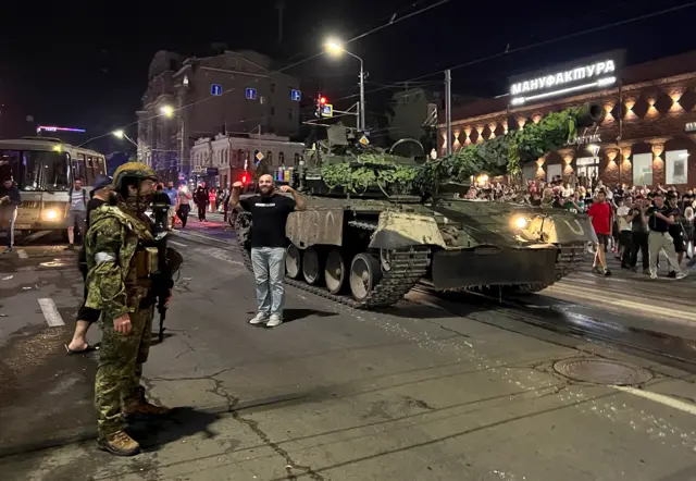 People gather to bid farewell to Wagner fighters as they leave the military headquarters in Rostov-on-Don