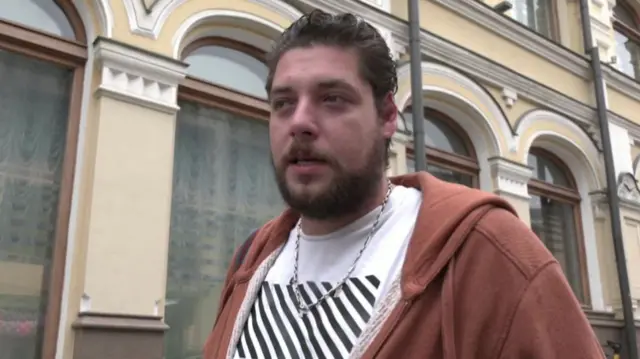 Nikolai speaking from a street in Moscow