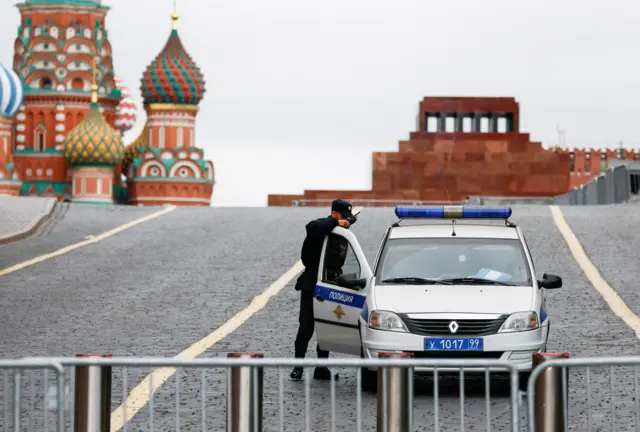 A police officer guards the closed Red Square in Moscow