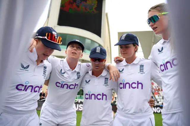 England women have a huddle before bowling at Australia