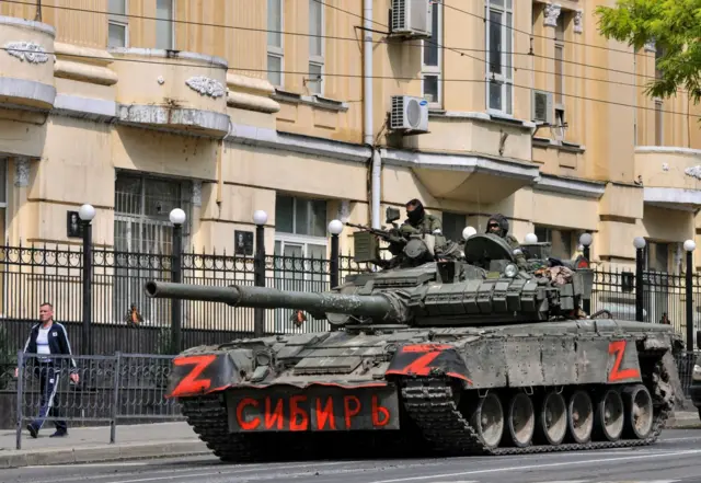 Servicemen believed to be from the Wagner group sit atop a tank in Rostov-on-Don, southern Russia. Photo: 24 June 2023