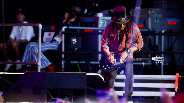 Slash with his guitar