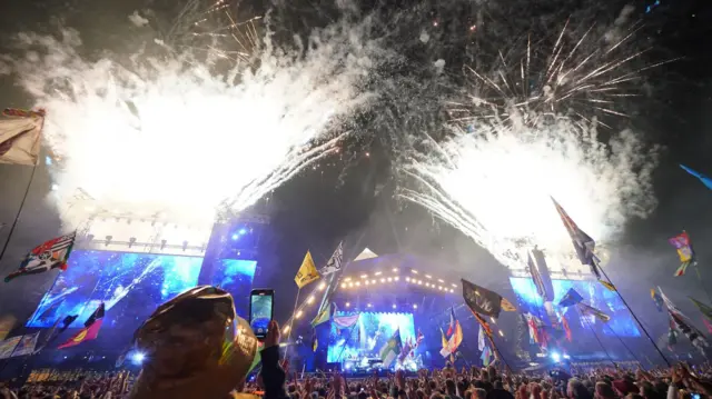 Fireworks light up the sky as Elton John performs on the Pyramid Stage