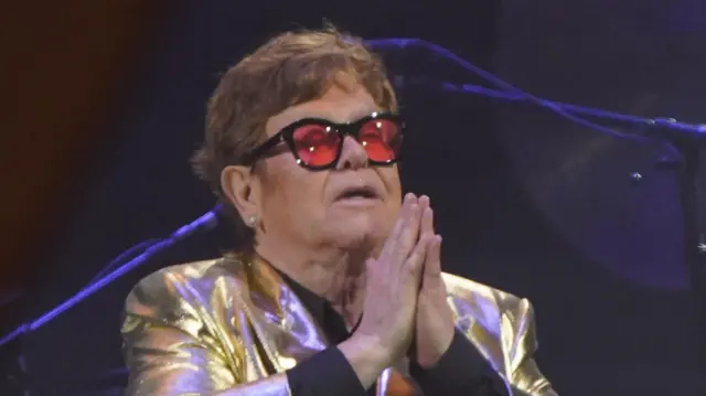 Elton John performing on the Pyramid Stage at the Glastonbury Festival