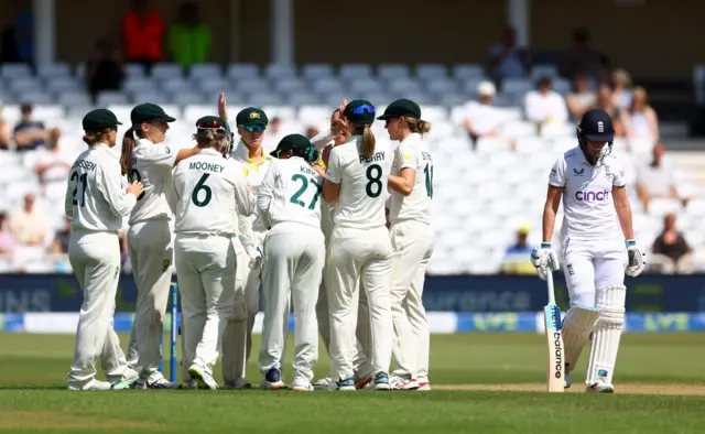 Australia celebrate the wicket of Kate Cross