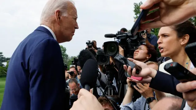 Biden speaks to reporters outside the White House