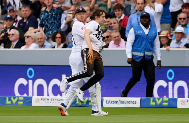 Jonny Bairstow carrying a Just Stop Oil protestor off the Lord's outfield