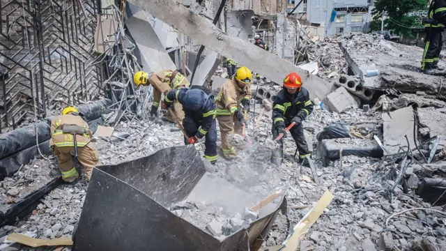 Rescuers digging through the rubble in Kramatorsk