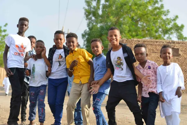 Sudanese children plays as Muslim worshippers who fled violence in Khartoum, gather to mark Eid al-Adha on June 28, 2023, in the region of Jazira, south of Khartoum. Fighting raged in the Sudanese capital on the eve of the Muslim holiday, after paramilitaries seized Khartoum's main police base. (Photo by AFP) (Photo by -/AFP via Getty Images)