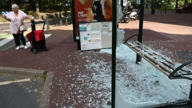 A destroyed bus- top on avenue Pablo Picasso following a night of civil unrest, in Nanterre, near Paris, France, 28 June 2023. The violence broke out after police fatally shot a 17-year-old during a traffic stop in Nanterre. According to the French interior minister, 31 people were arrested with 2,000 officers being deployed to prevent further violence. Clean up in Nanterre after riots over teenager fatally shot by police, France - 28 Jun 2023