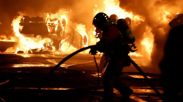 A firefighter tackling a blaze