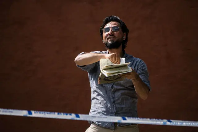 Salwan Momik destroying a book