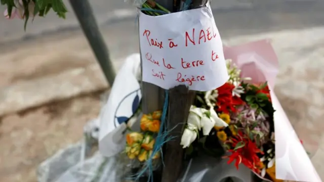 Flowers are seen at the site where Nahel, killed by a French police officer during a traffic stop, in Nanterre,