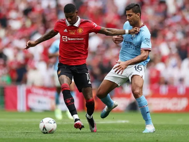 Rashford knocks it away from Rodri