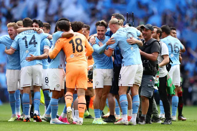 Jack Grealish is embraced by his team mates