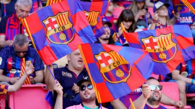 Barcelona fans wave flags