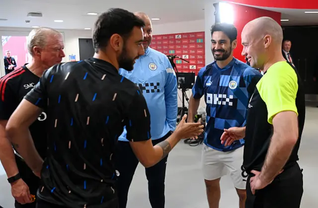 Fernandes and Gundogan meet the referee in the tunnel