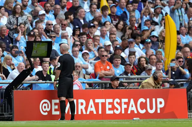 The referee checks VAR