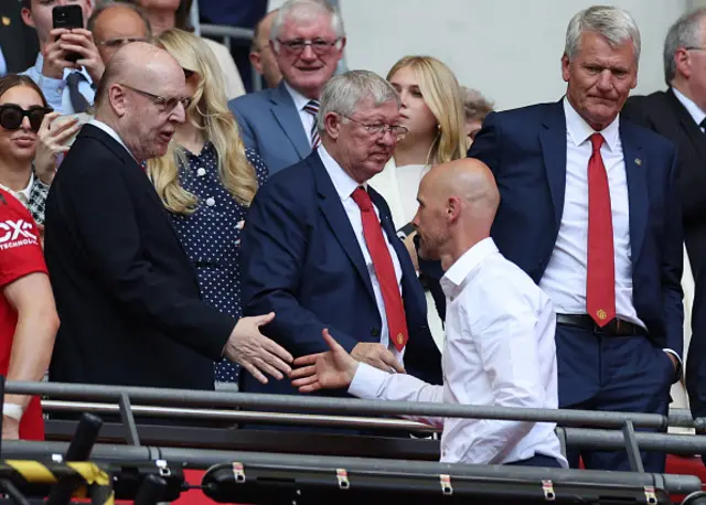 Erik Ten Hah shakes owner Avram Glazer's hand after the game