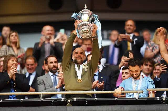 Pep lifts the trophy