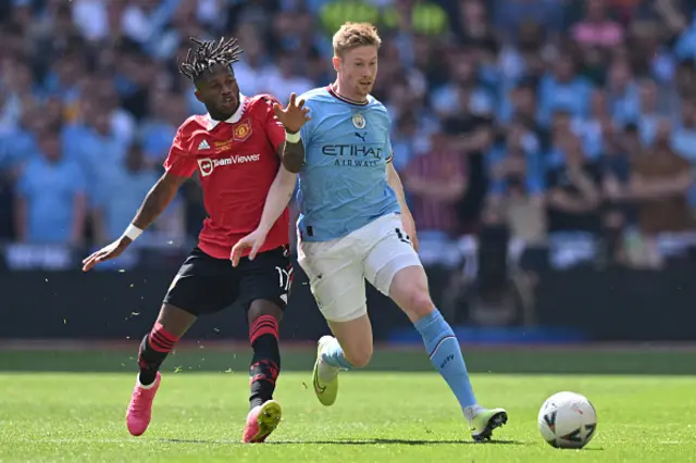 Fred battles with Kevin De Bruyne