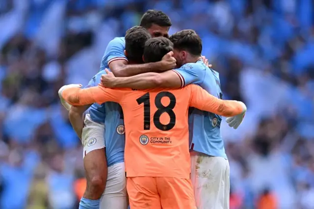 Man City fans celebrate the victory