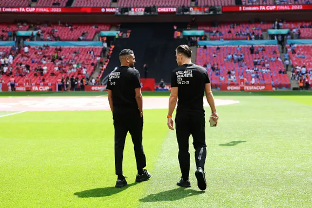 Mahrez and Grealish check the pitch out wearing their tracksuits