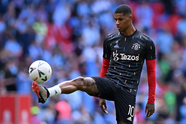 Rashford warms up before kick off