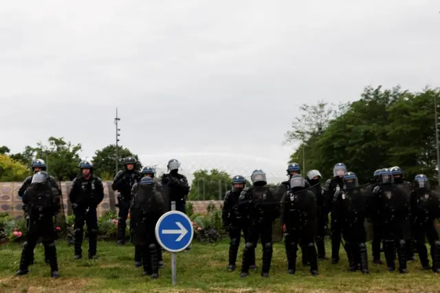 Riot police stand guard during riots in Lille, France