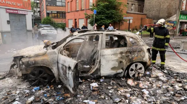 Burnt out car Alma district in Roubaix, northern France,