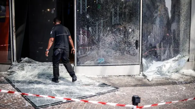 A smashed shop window in Paris