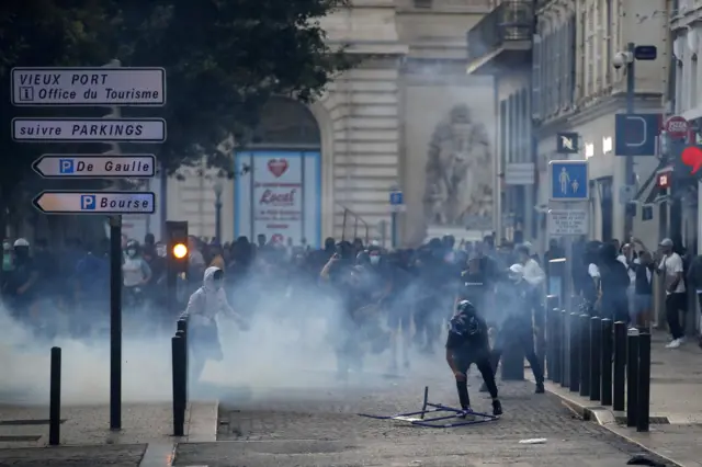 People clash with riot police during a demonstration in Marseille, France.