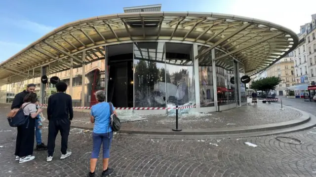 Smashed windows at the Nike store at Westfield Forum des Halles shopping centre