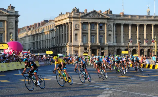 Cyclists from the Tour de France travel through Paris