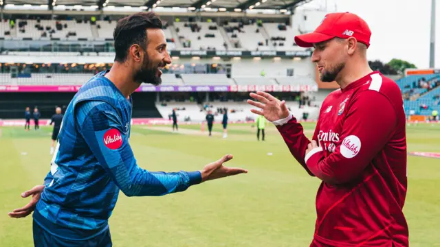 Shan Masood shakes hands with Liam Livingstone before Yorkshire v Lancashire on 1 June