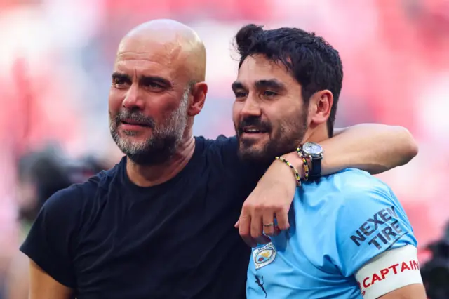 Ilkay Gundogan and Pep Guardiola at full-time of the FA Cup final